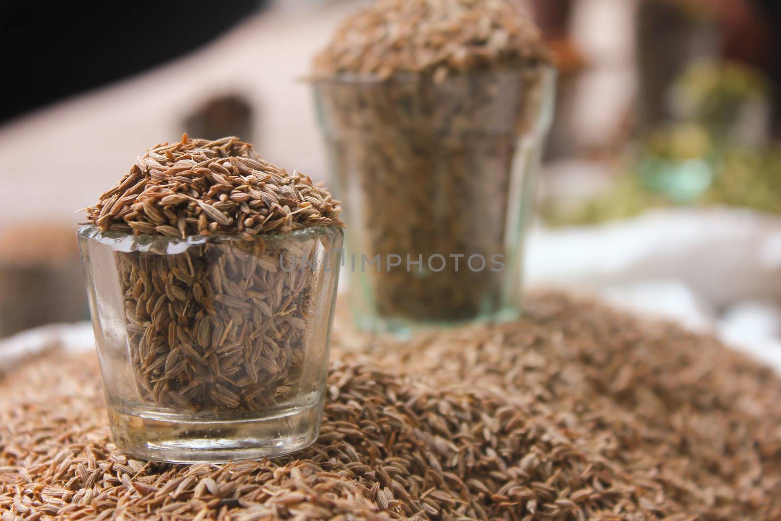 Close-up view of glass filled with Cumin seeds, jeera