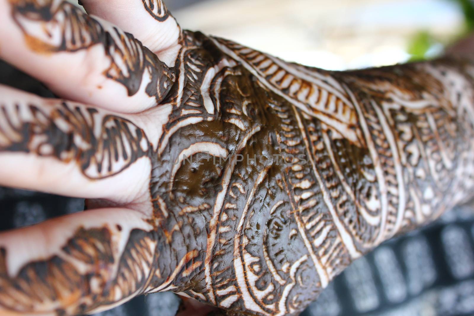 Henna is applied to the hands of a Hindu Bride