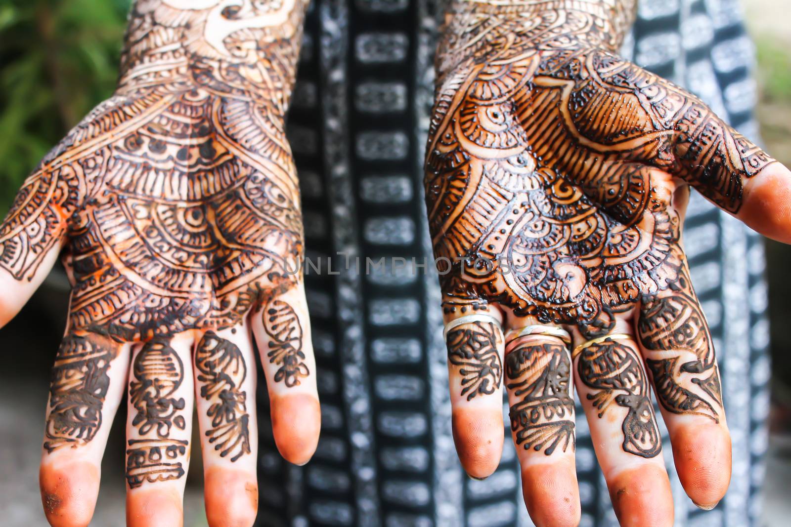 Henna is applied to the hands of a Hindu Bride