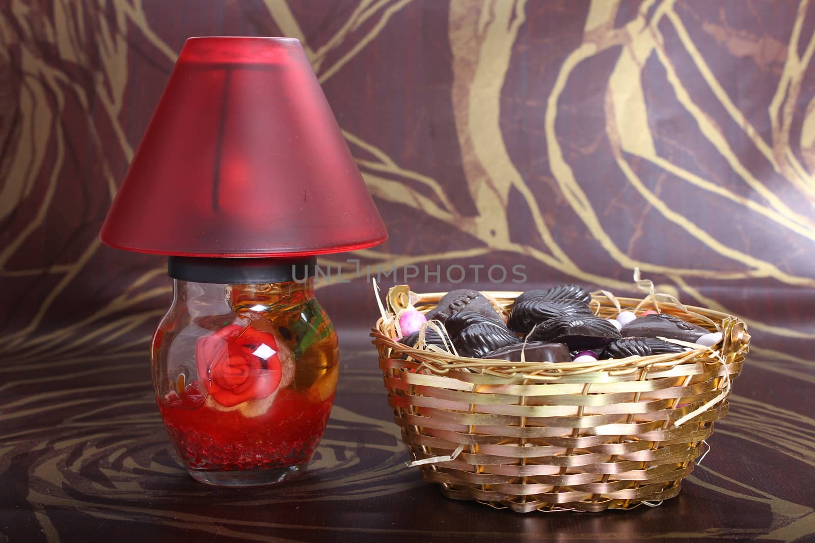 decorated red lamp with metallic bowl, home made chocolates concept