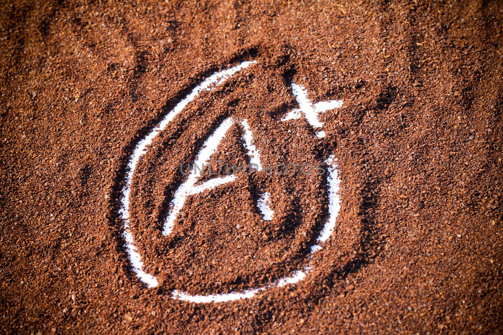 close up look at A plus shape on cocoa powder