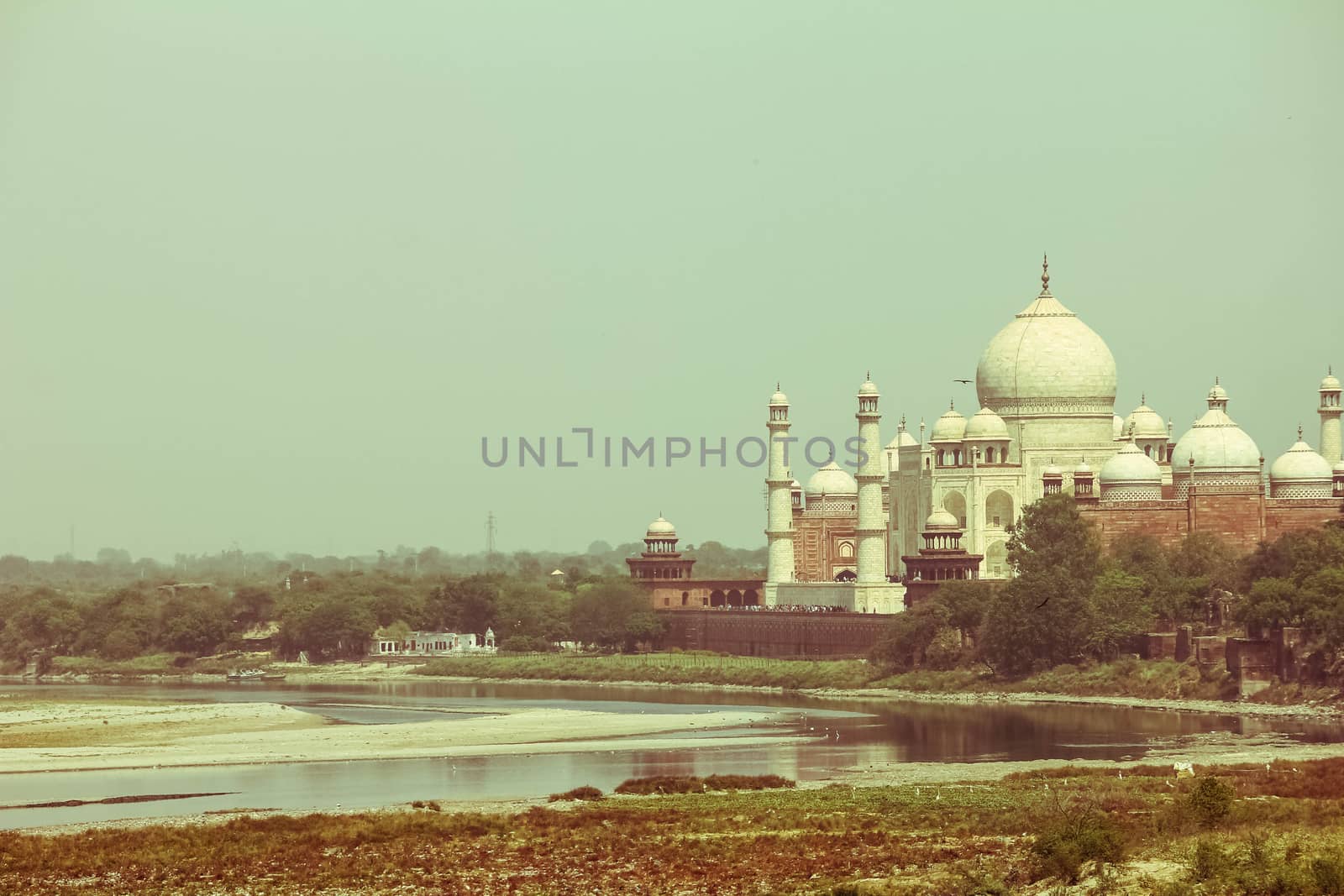 The Taj Mahal is an ivory-white marble mausoleum on the south bank of the Yamuna river in the Indian city of Agra, Uttar Pradesh, retro style