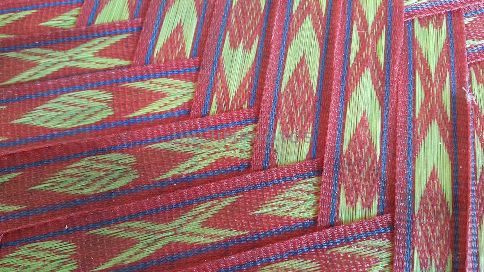 Colorful plastic woven stripes of traditional bed used in rural areas.