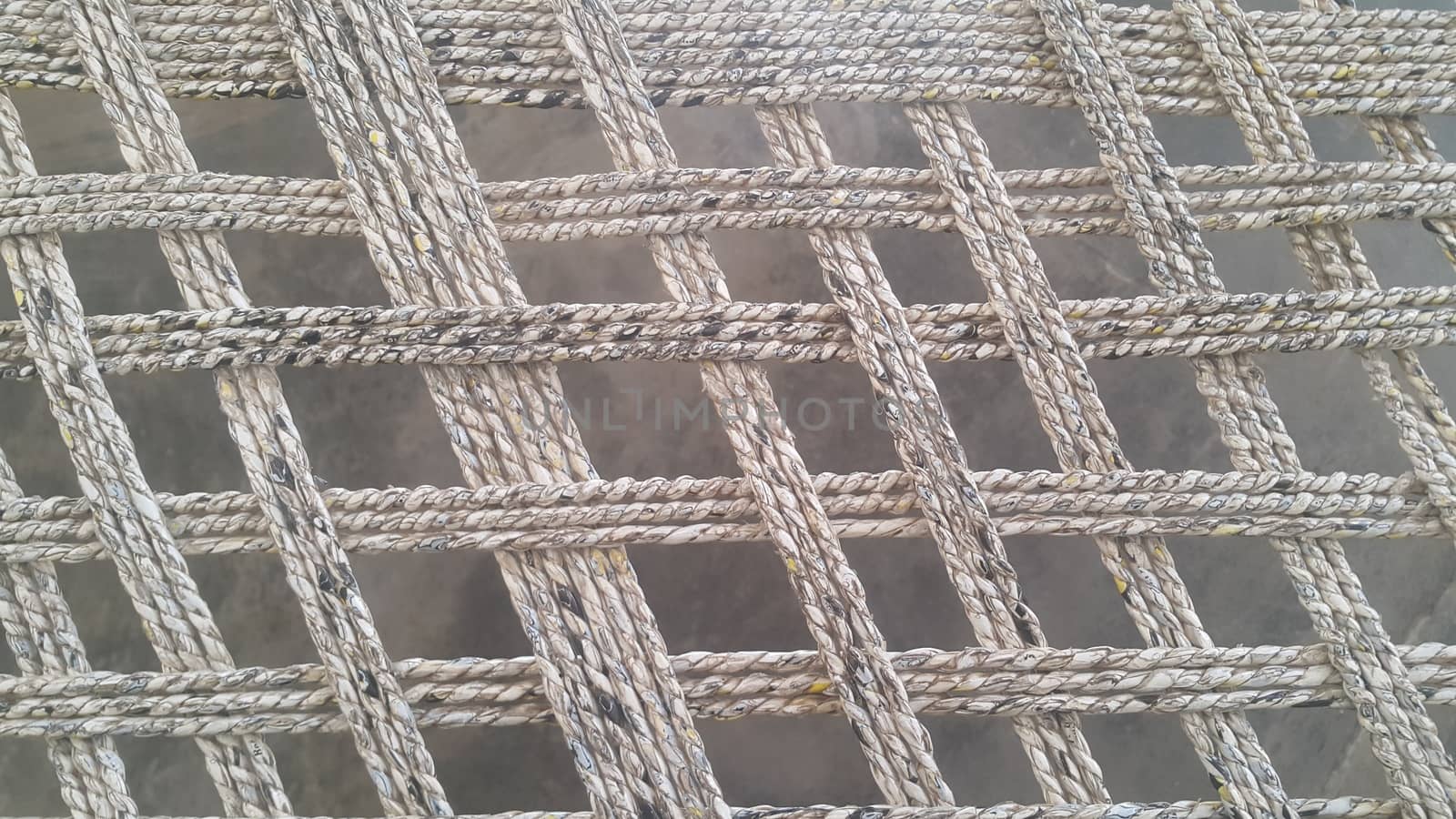 Closeup view of dried jute thread or ropes interwoven for making traditional old style bed called charpai