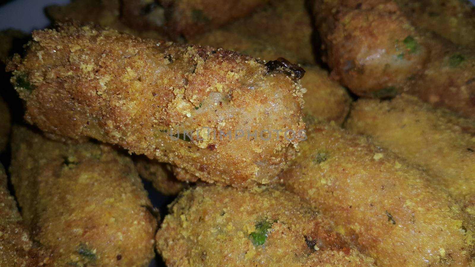 Closeup perspective view of home made spicy and delicious croquettes served with tea or other dishes during parties as fast food.