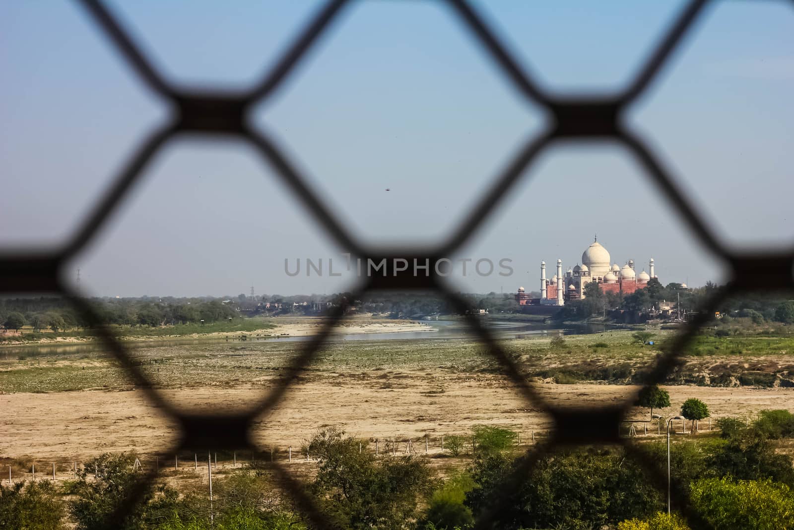 View of Taj Mahal from lattice jali in Agra, Uttar Pradesh, India. It was build in 1632 by Emperor Shah Jahan as a memorial for his second wife Mumtaz Mahal