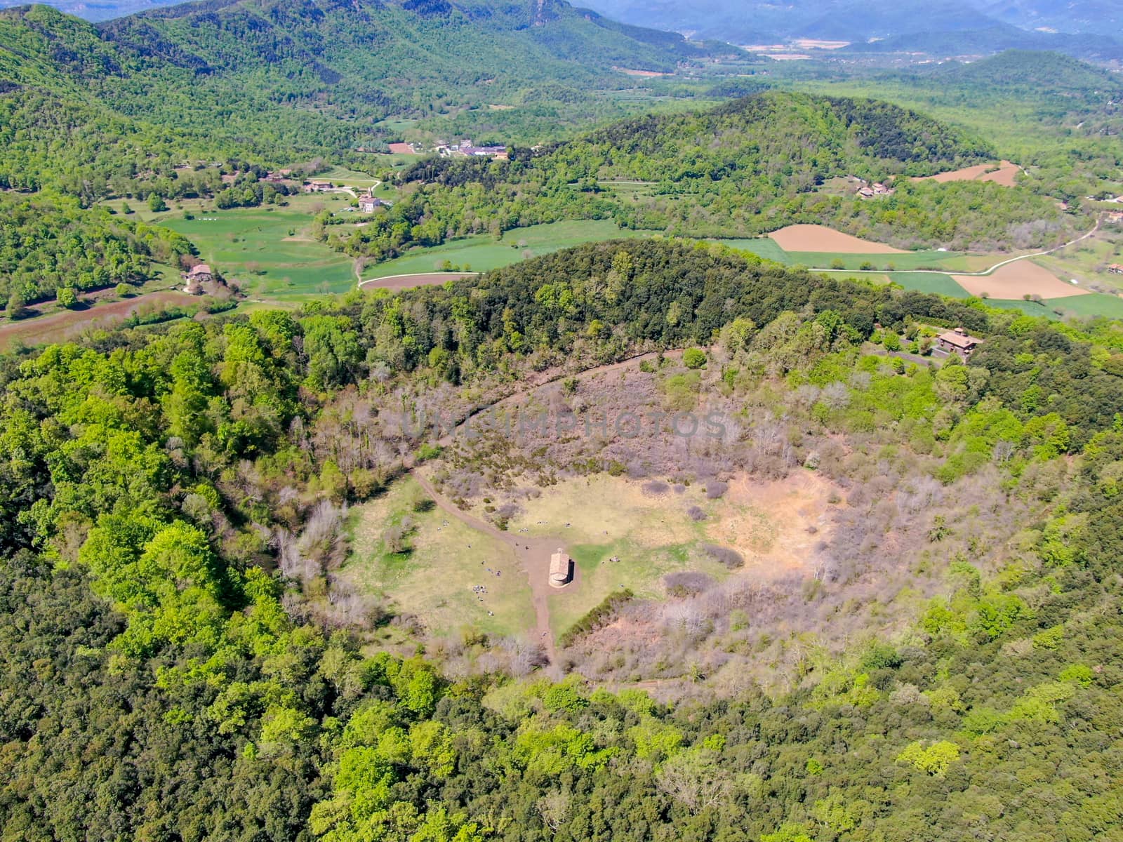 The Santa Margarida Volcano is an extinct volcano in the comarca of Garrotxa, Catalonia, Spain. The volcano has a perimeter of 2 km and a height of 682 meters in Garrotxa Volcanic Zone Natural Park