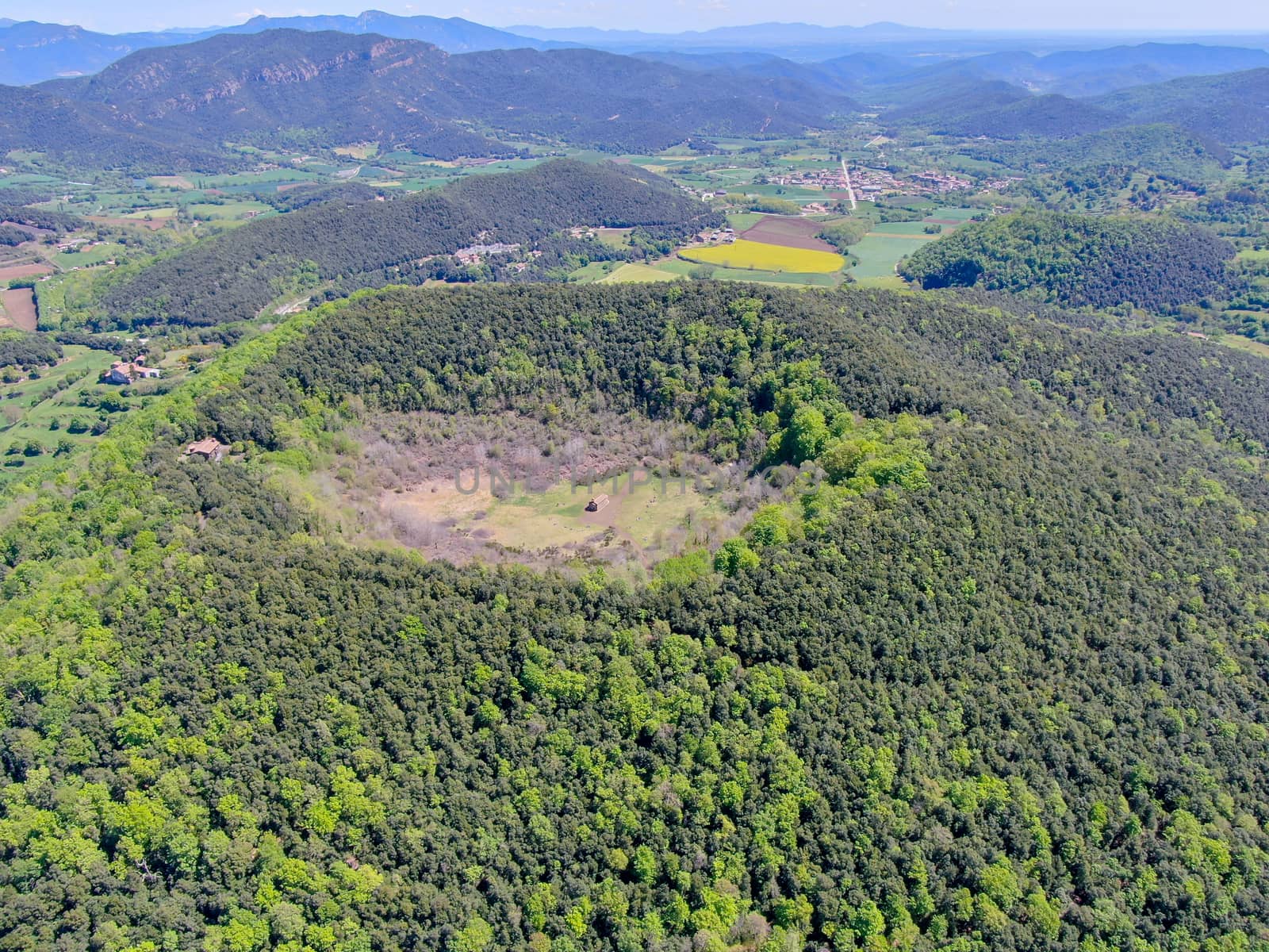 The Santa Margarida Volcano is an extinct volcano in the comarca of Garrotxa, Catalonia, Spain. The volcano has a perimeter of 2 km and a height of 682 meters in Garrotxa Volcanic Zone Natural Park