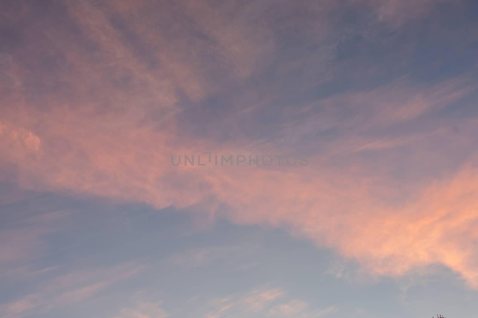 A Gorgeous Blue Sky With Pink Clouds at Sunset for Sky Replacement