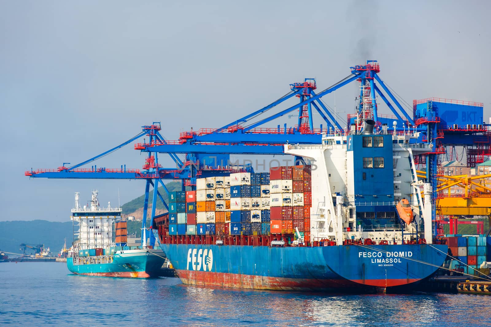 Summer, 2016 - Vladivostok, Russia - Vladivostok Sea Port. Commercial coasters are loading at the commercial port of Vladivostok.