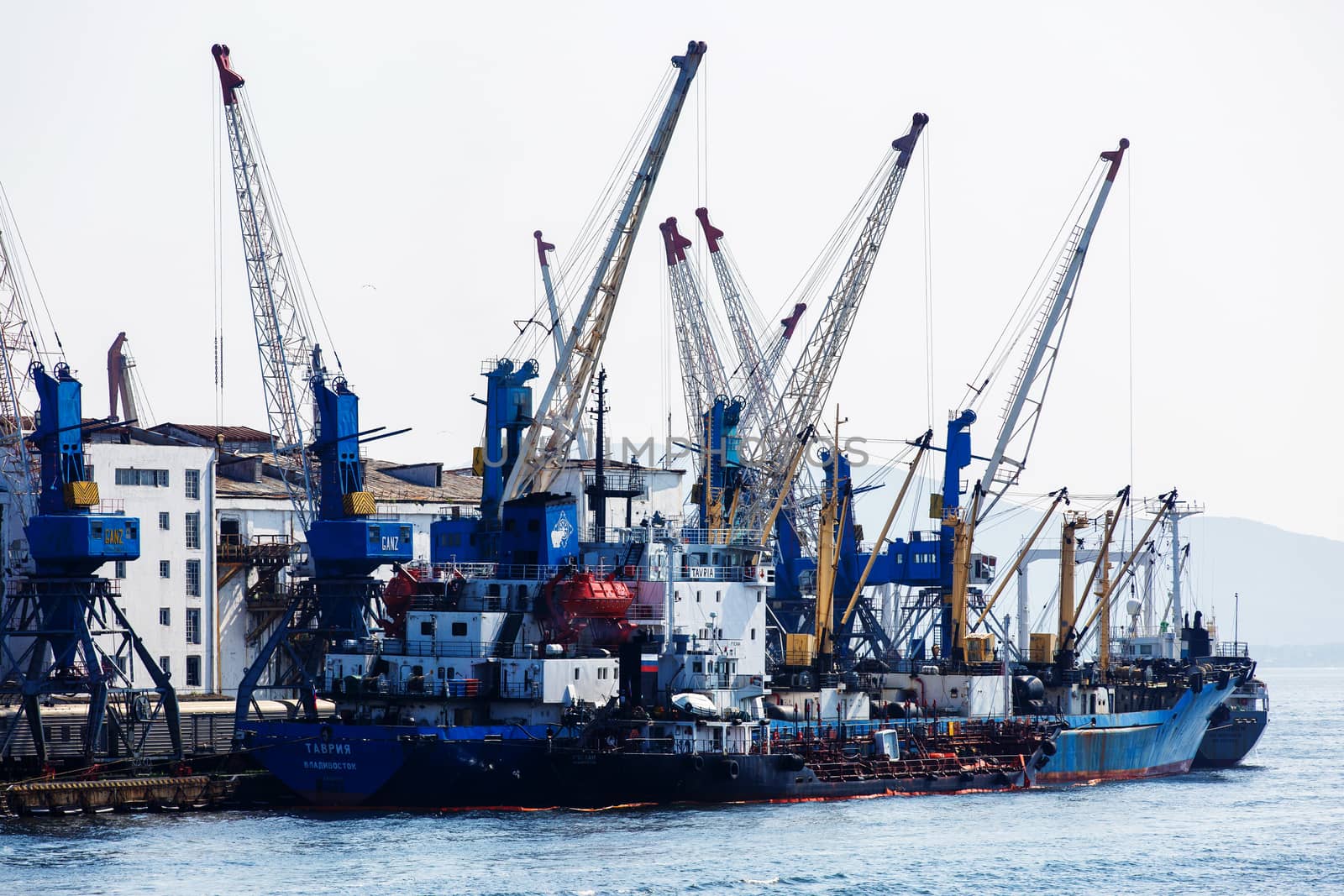 Summer, 2016 - Vladivostok, Russia - Vladivostok Sea Port. Commercial coasters are loading at the commercial port of Vladivostok.