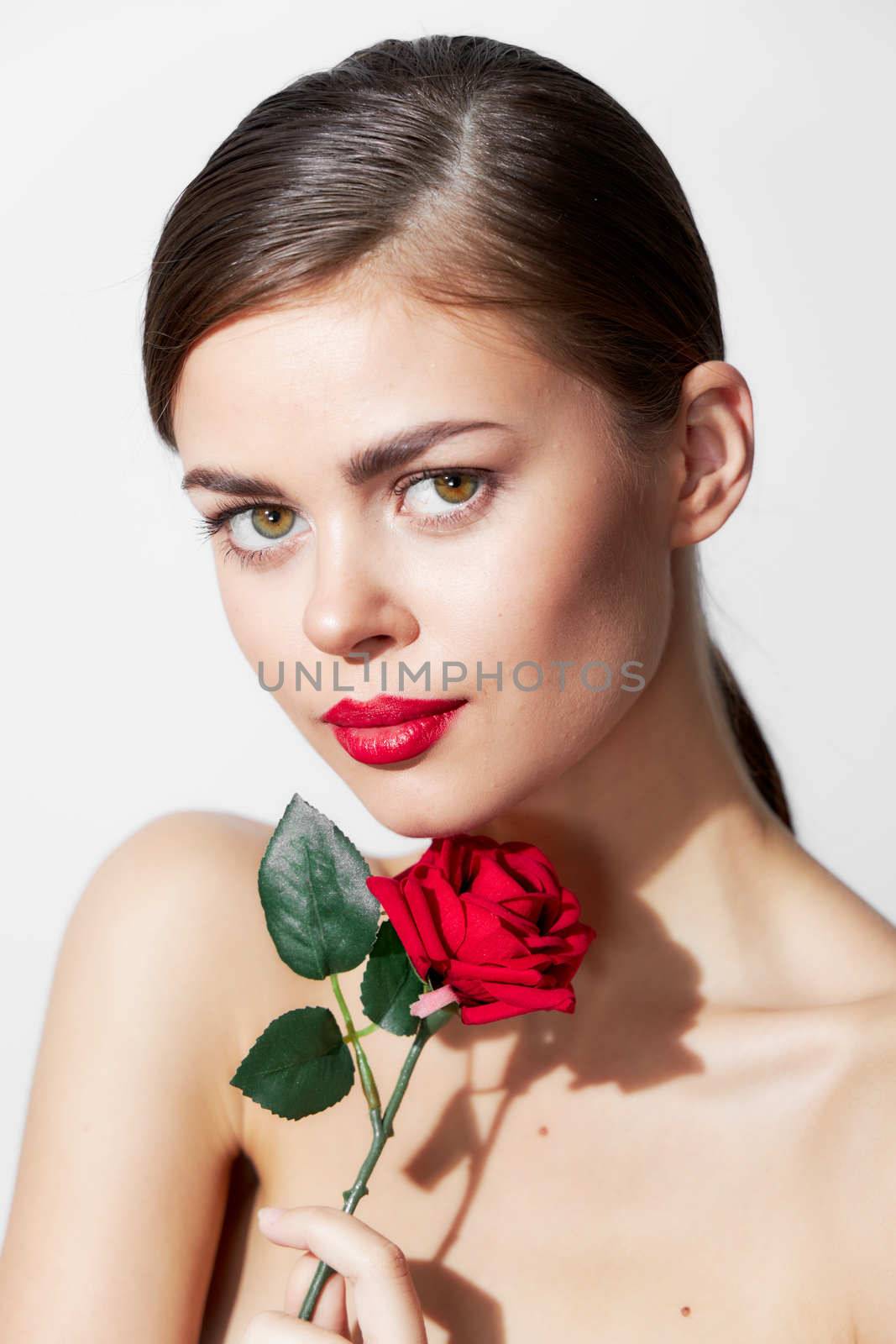 Brunette with a rose Bare shoulders Forward glance luxury red lips