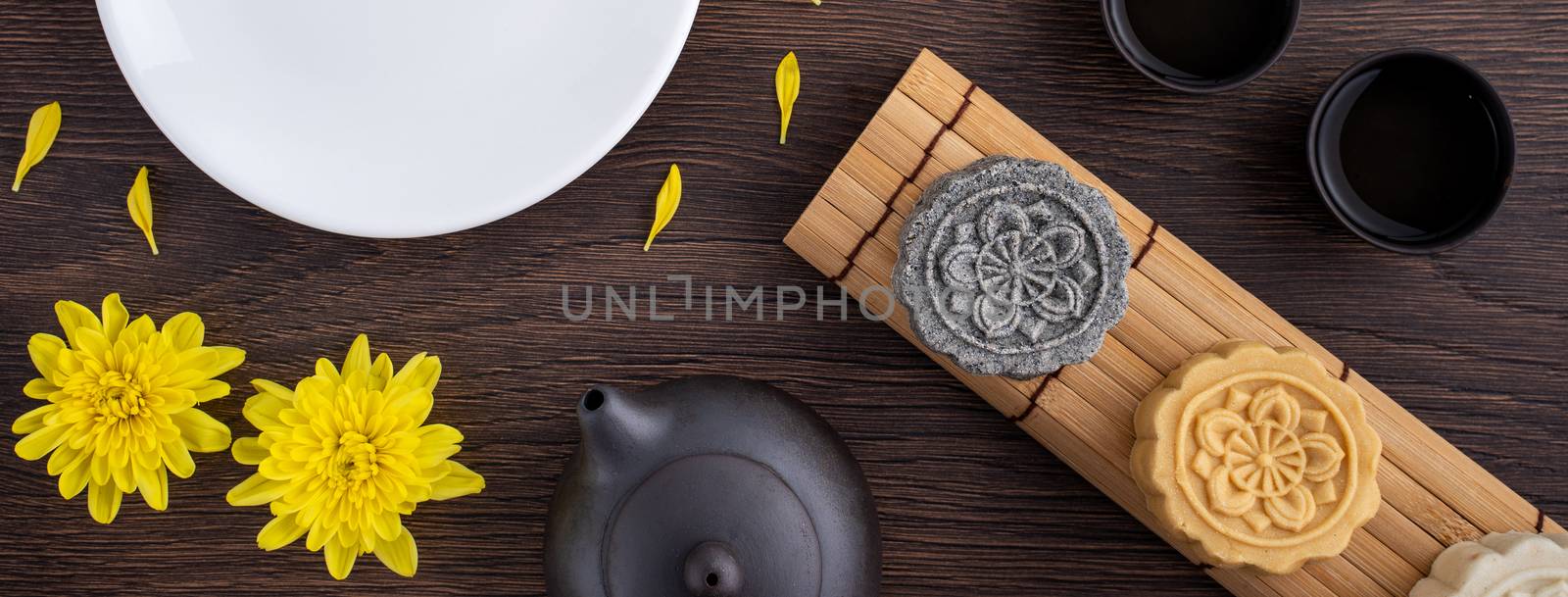 Colorful beautiful moon cake, mung bean cake, Champion Scholar Pastry cake for Mid-Autumn festival traditional gourmet dessert snack, top view, flat lay.