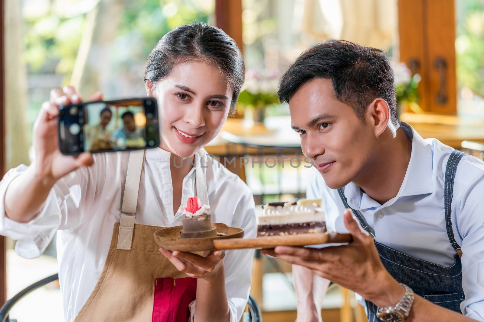 Couple Asian two partner of small business owner taking selfie a by Tzido