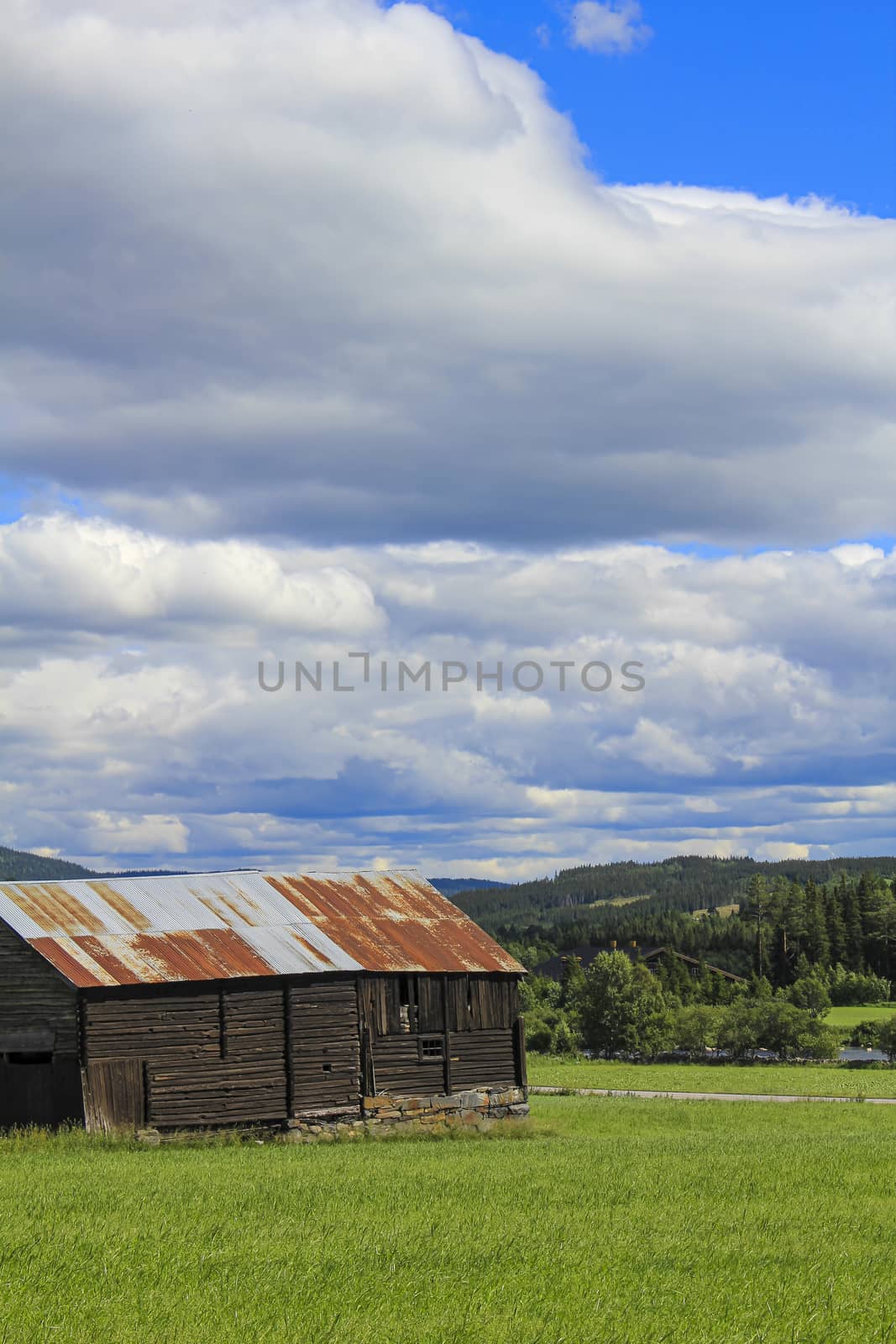 Old brown rusted metal wooden cabin hut in Hemsedal, Norway. by Arkadij