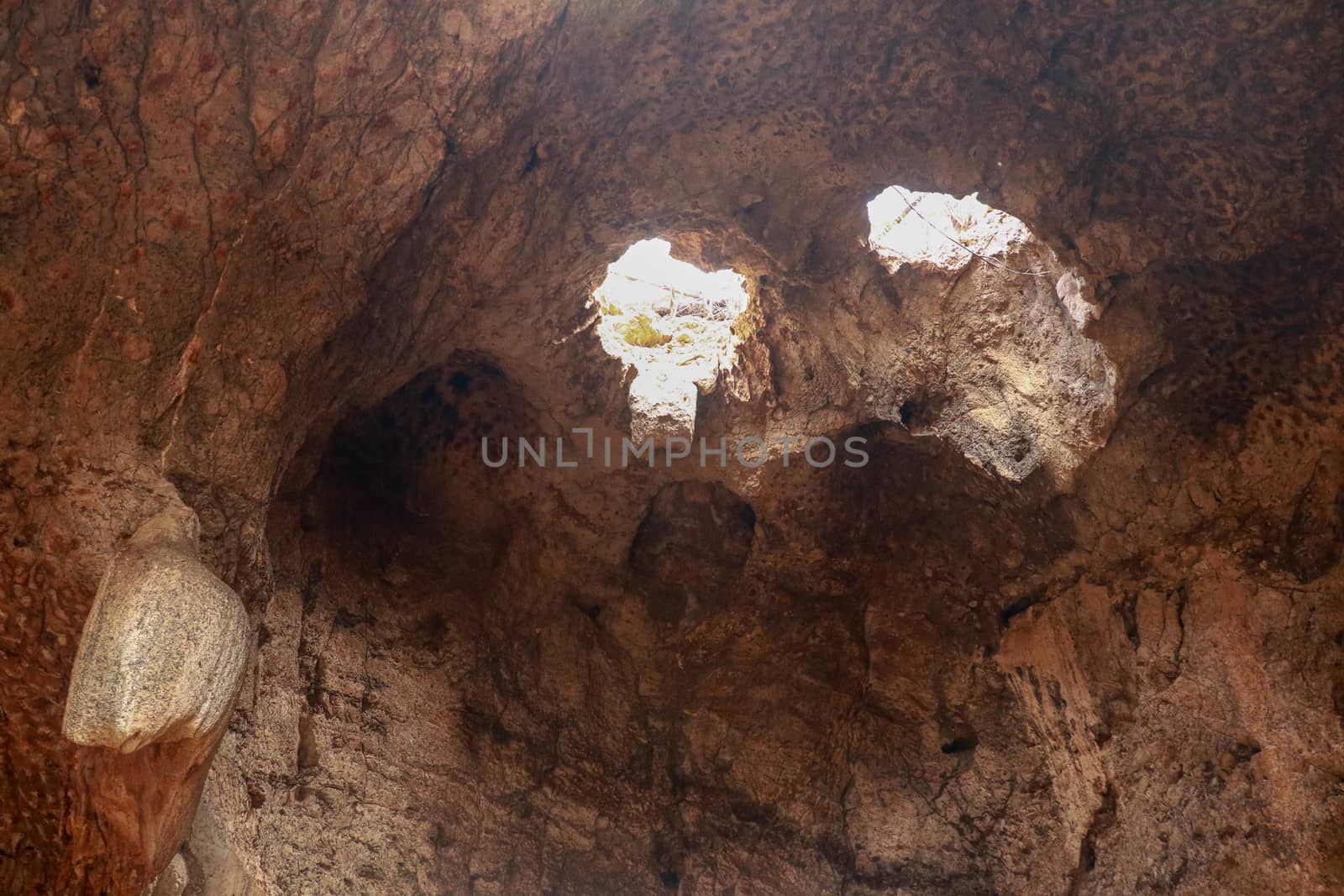 High angle view of rock formation. Fallen cave ceiling. A hole in the ceiling of the cave.
