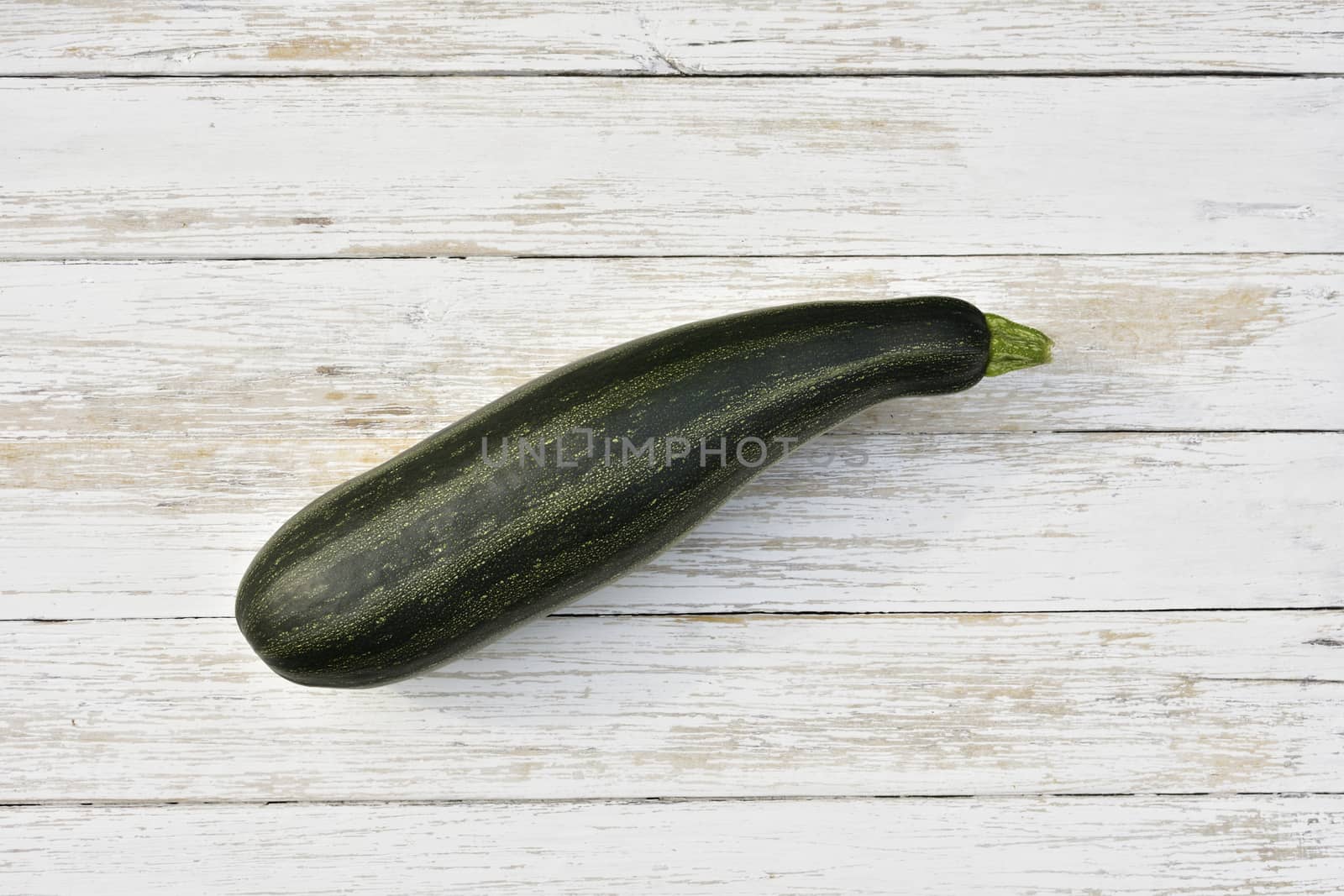 zucchini on a wooden vintage table, top view