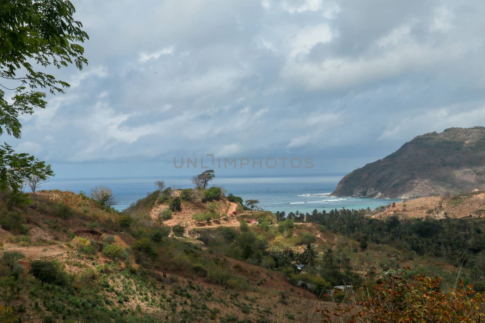 Panoramic view of Areguling beach in Lombok, Indonesia. Kuta Lombok is an exotic paradise on the Indonesian island. View over tropical landscape of the bay.