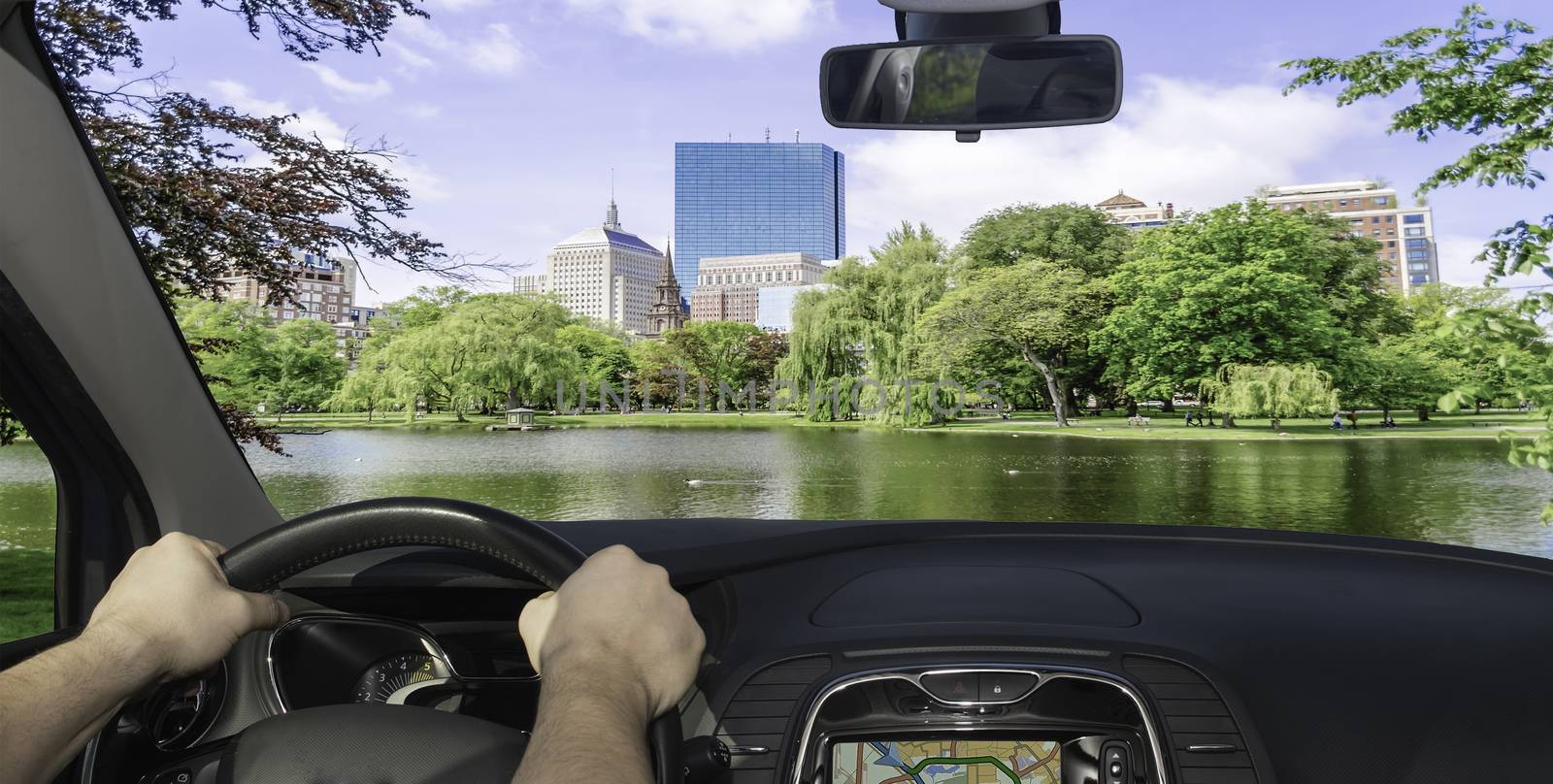 Driving a car in towards the scenic Boston Public Garden, USA