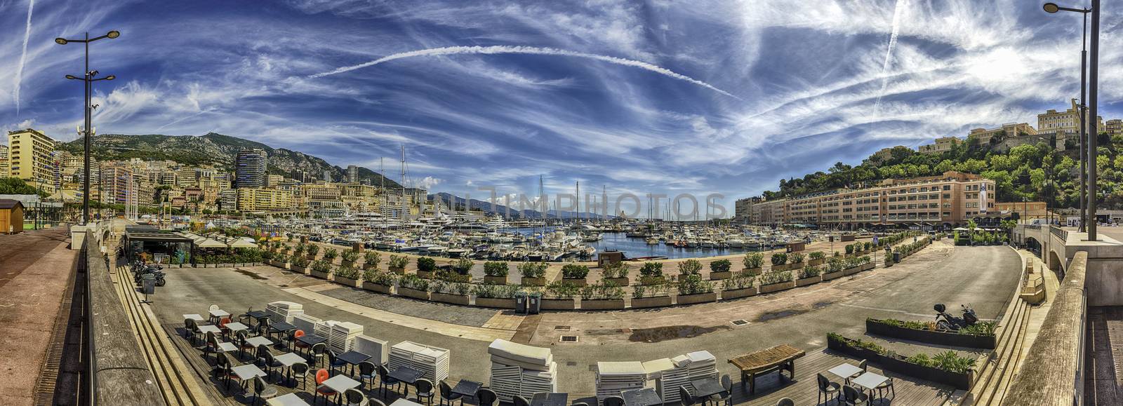 Panoramic view over luxury yachts and apartments of Port Hercules in La Condamine district, city centre and harbour of Monte Carlo, Cote d'Azur, Monaco, iconic landmark of the French Riviera