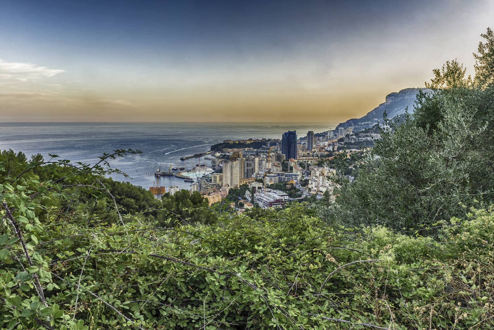 Panoramic view of Monaco at sunset from the Grande Corniche road, iconic landmark in Cote d'Azur, French Riviera