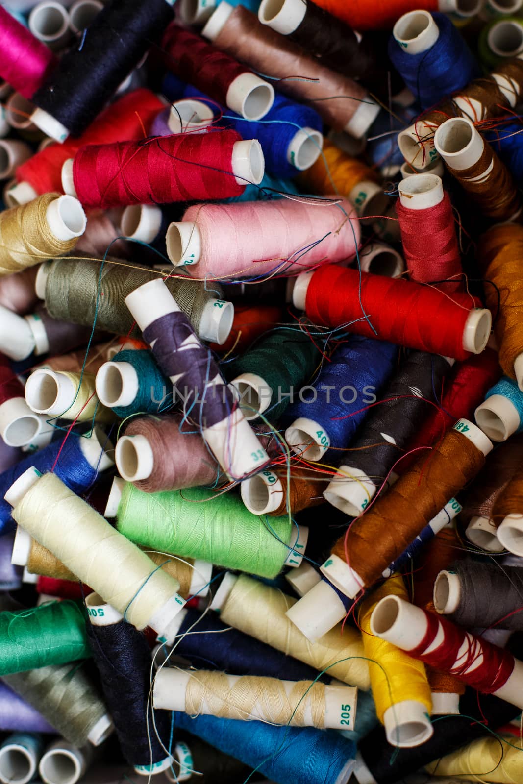 closeup set of skeins of multi-colored sewing thread.Tailor industry.