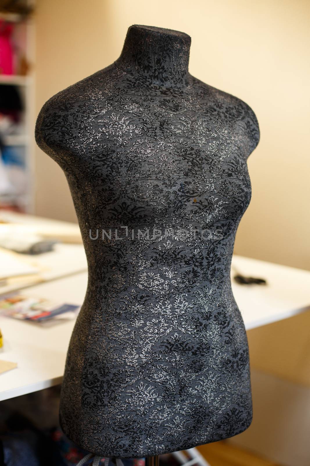 Black color mannequin for fitting and tailoring in workshop. Tailor industry.