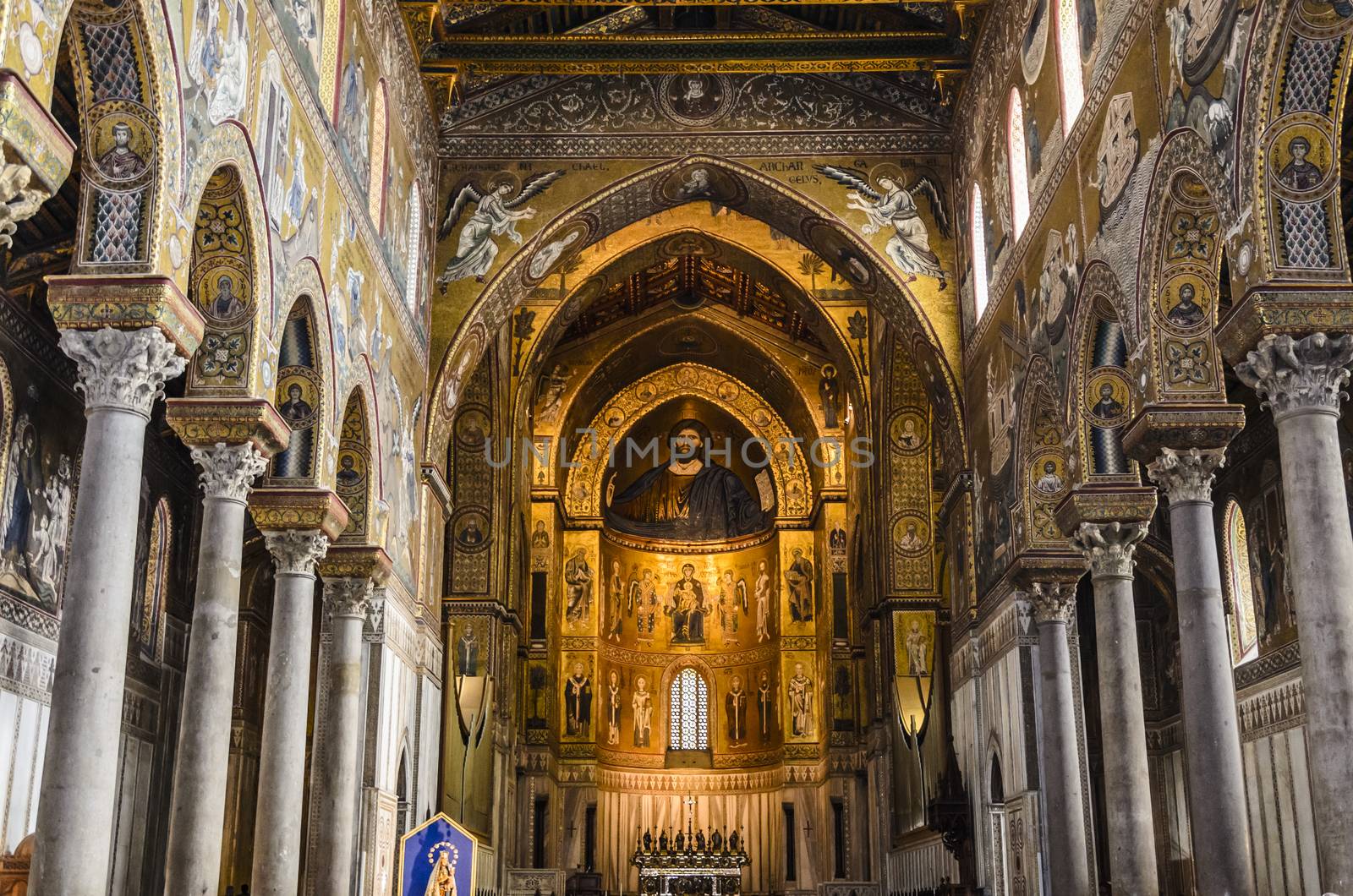 Main nave of the cathedral of the city of monreale with all its ornaments colonnades and colorful icons and inscriptions sicily near palermo