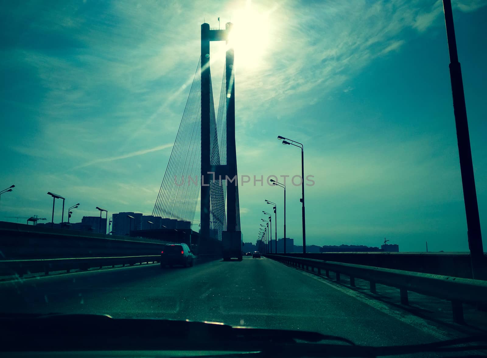 drive on the bridge over the Dnieper in the city at sunset by mtx