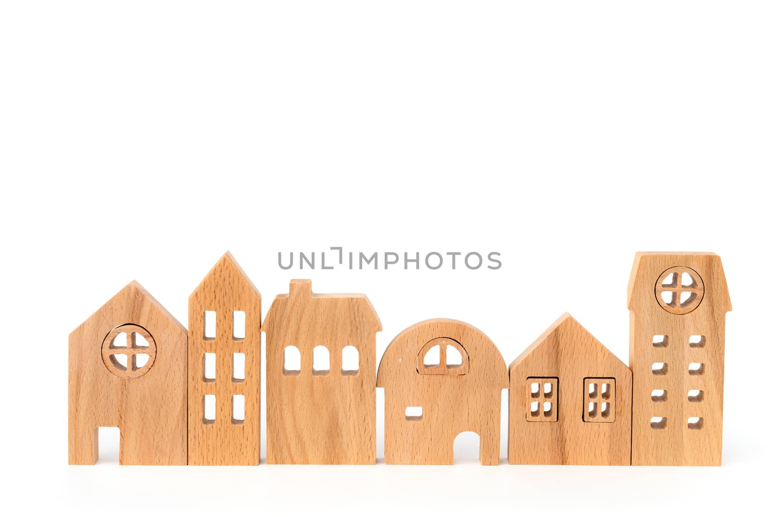 Wooden house model on white background for housing and property concept