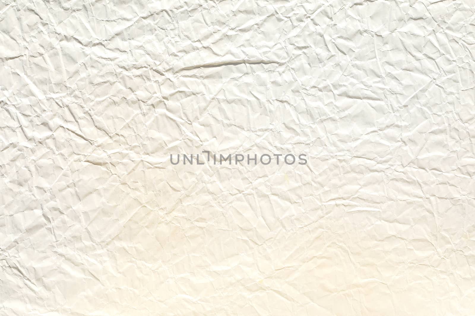 Crumpled old pale brown paper background texture