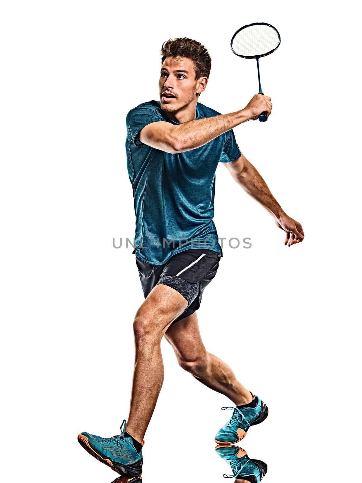 one caucasian youg Badminton player man in studio isolated on white background