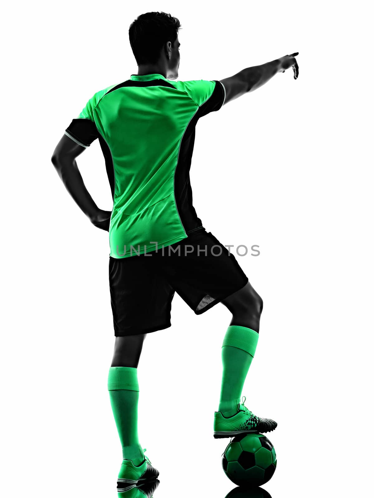 one young caucasian soccer player silhouette shadow in studio isolated on white background