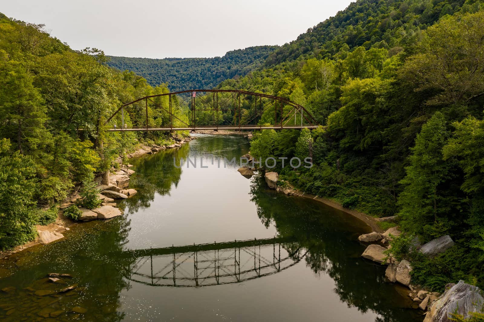 Aerial view of 1912 historic metal truss Jenkinsburg Bridge near Mt Nebo and Morgantown over Cheat River