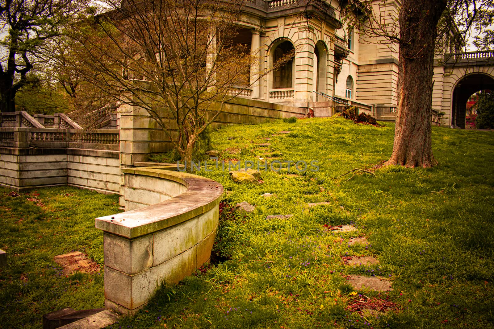 Stepping Stones Leading Up to an Arched Entrance to an Ornamental Stone Mansion