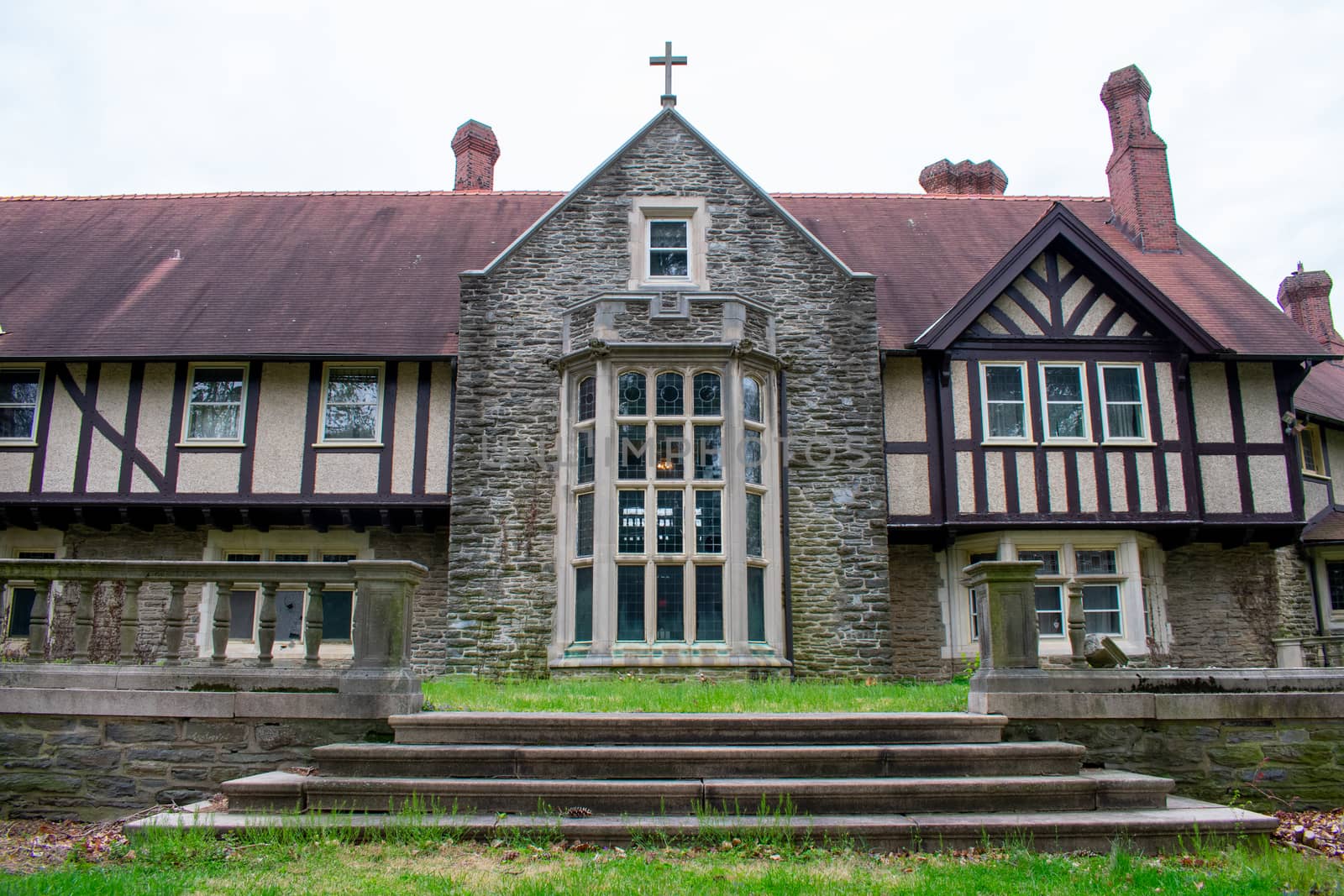 A Detailed and Ornamental Cobblestone Building With a Red Roof