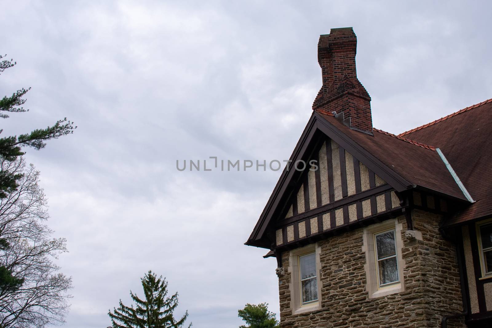 A Detailed Cobblestone Building With a Red Roof by bju12290