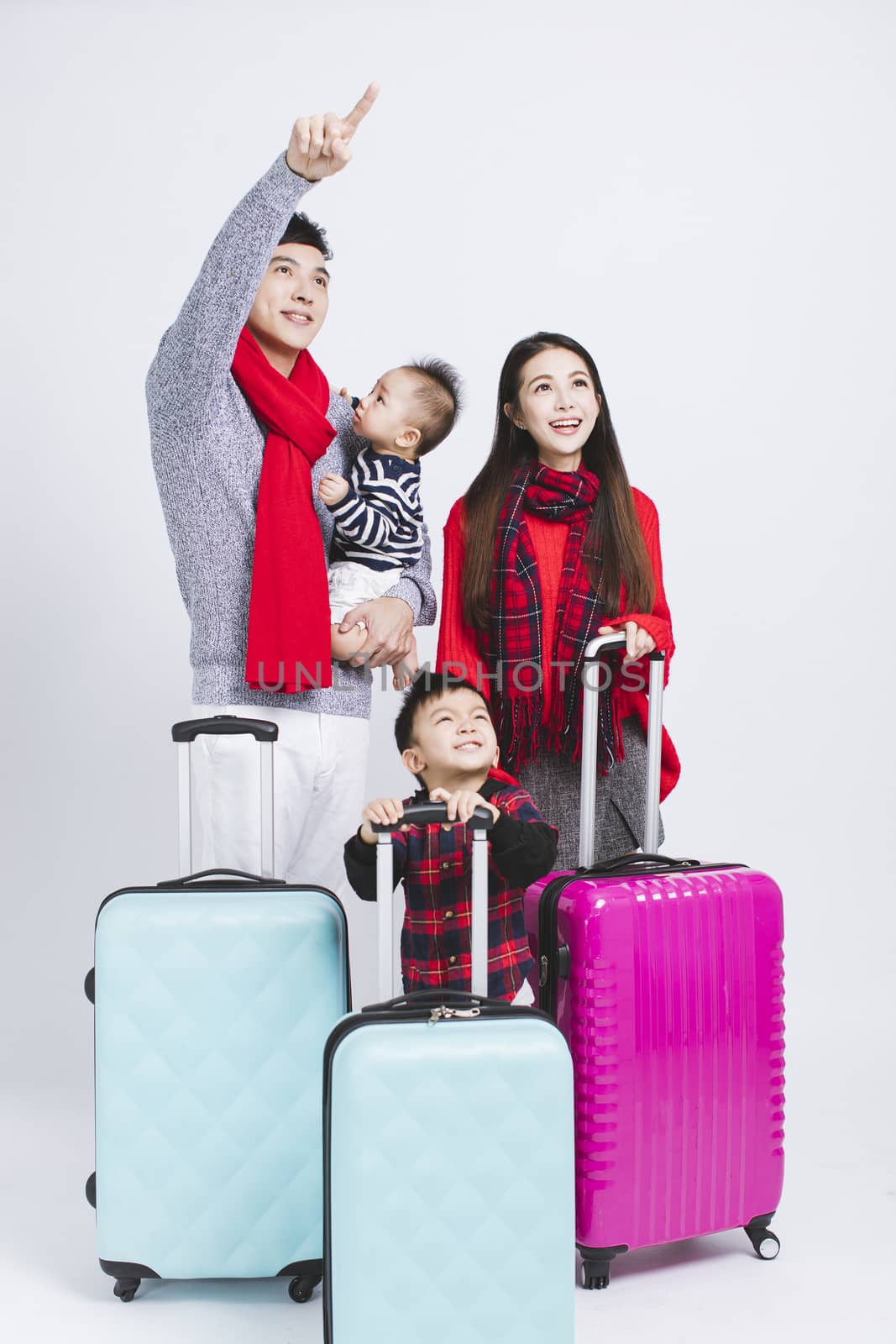 happy family wearing warm clothes on white background. and Winter vacation concepts by tomwang