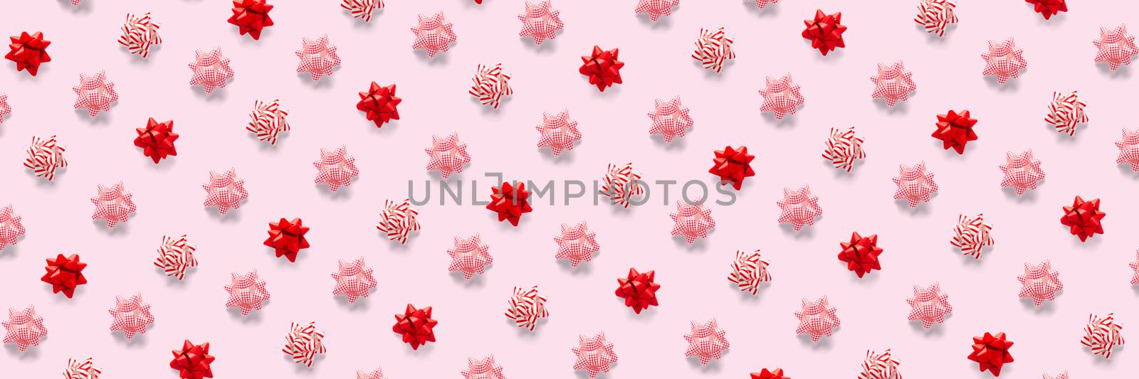 modern christmas background on pink backdrop. creative flat lay for christmas time, banners, posters, prints and other creative works. not seamless pattern