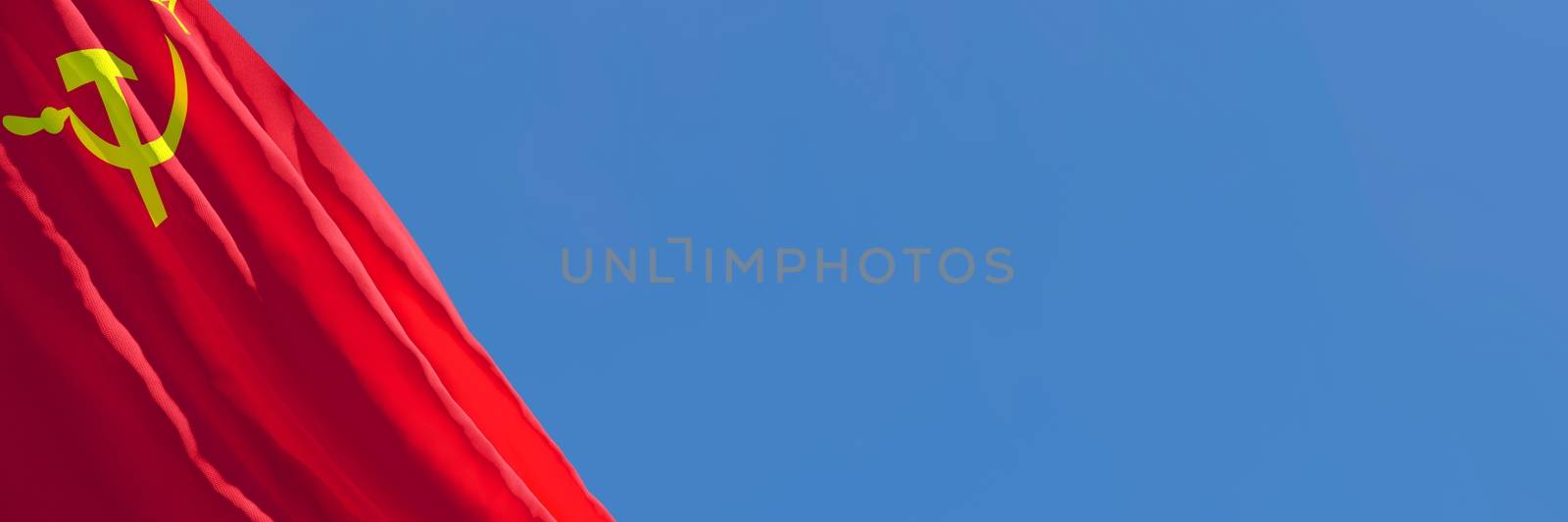 3D rendering of the national flag of USSR waving in the wind against a blue sky