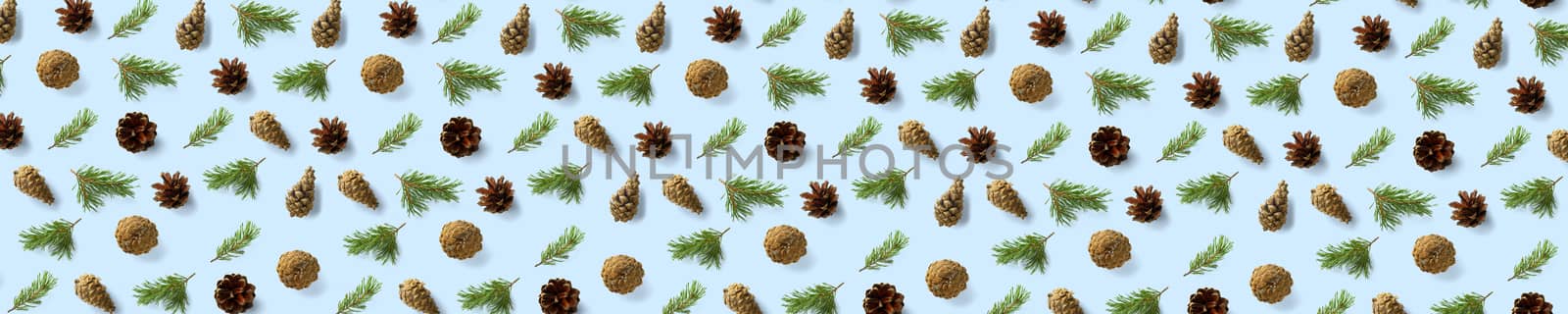 Pine cone Christmas background on blue. Pine branches and cones. minimal creative cone arrangement pattern. flat lay, Modern christmas Background. by PhotoTime