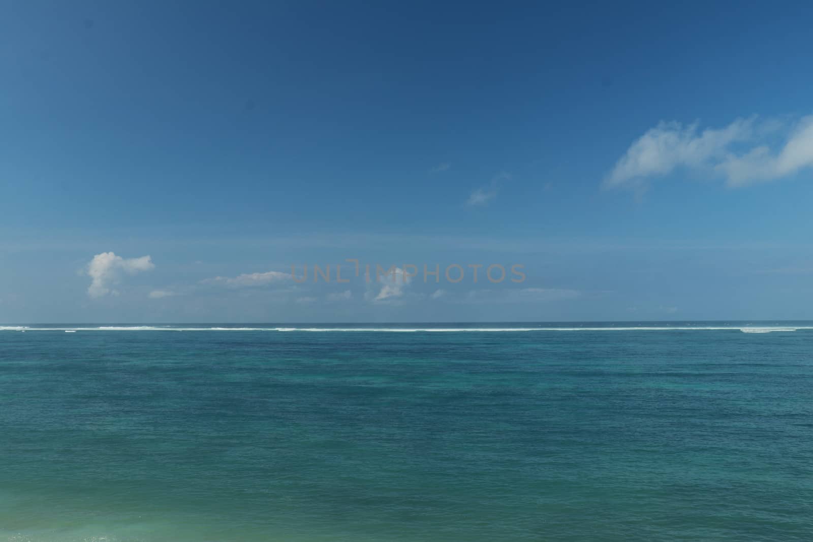 Blue sea and sky with white clouds. Holiday concept.