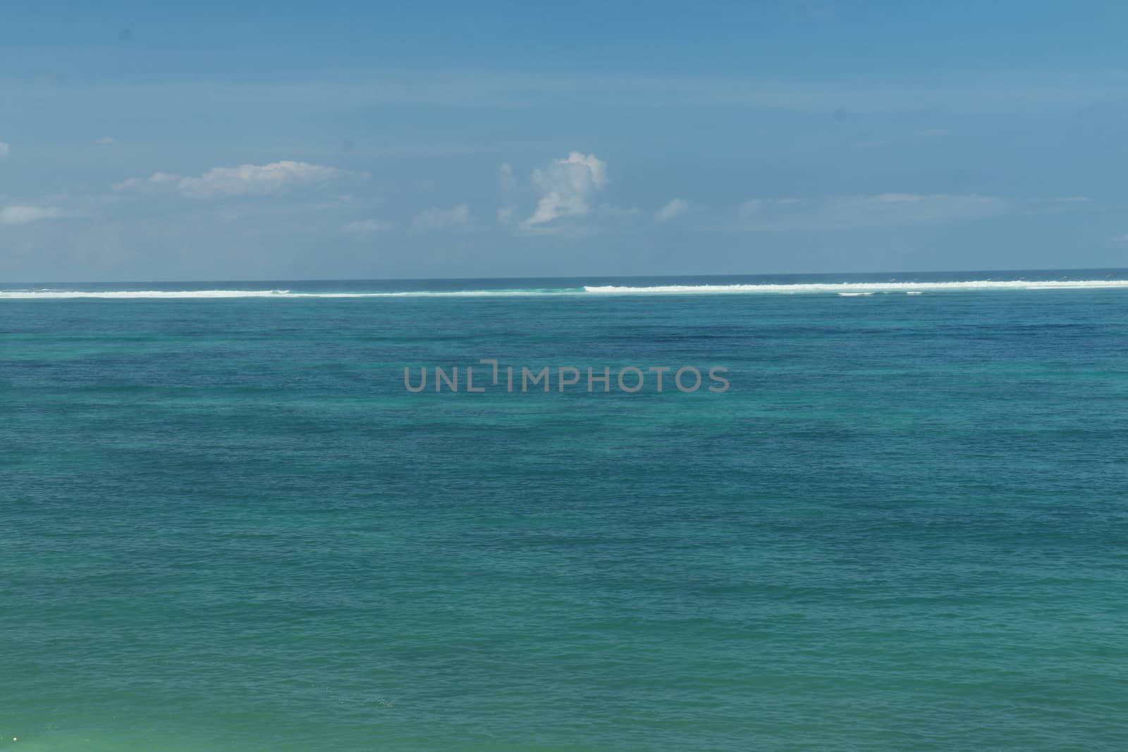 Blue sea and sky with white clouds. Holiday concept.