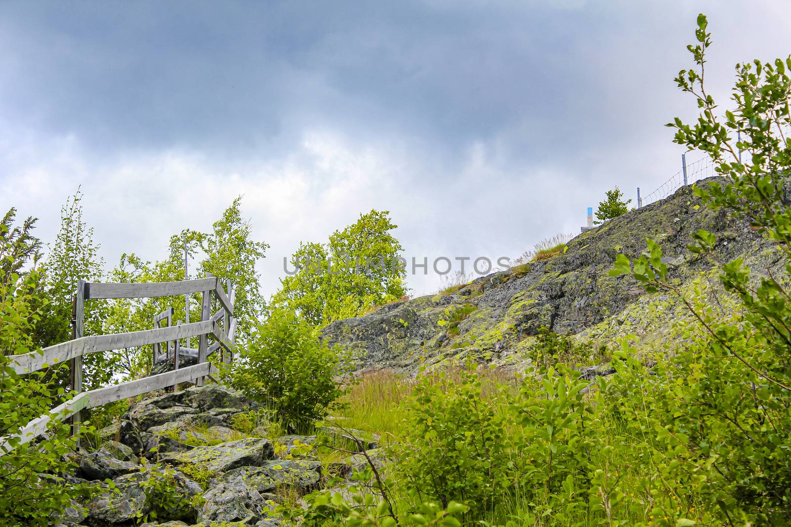 Stunning Norwegian landscape with mountains and valley behind a fence in Hemsedal, Norway.