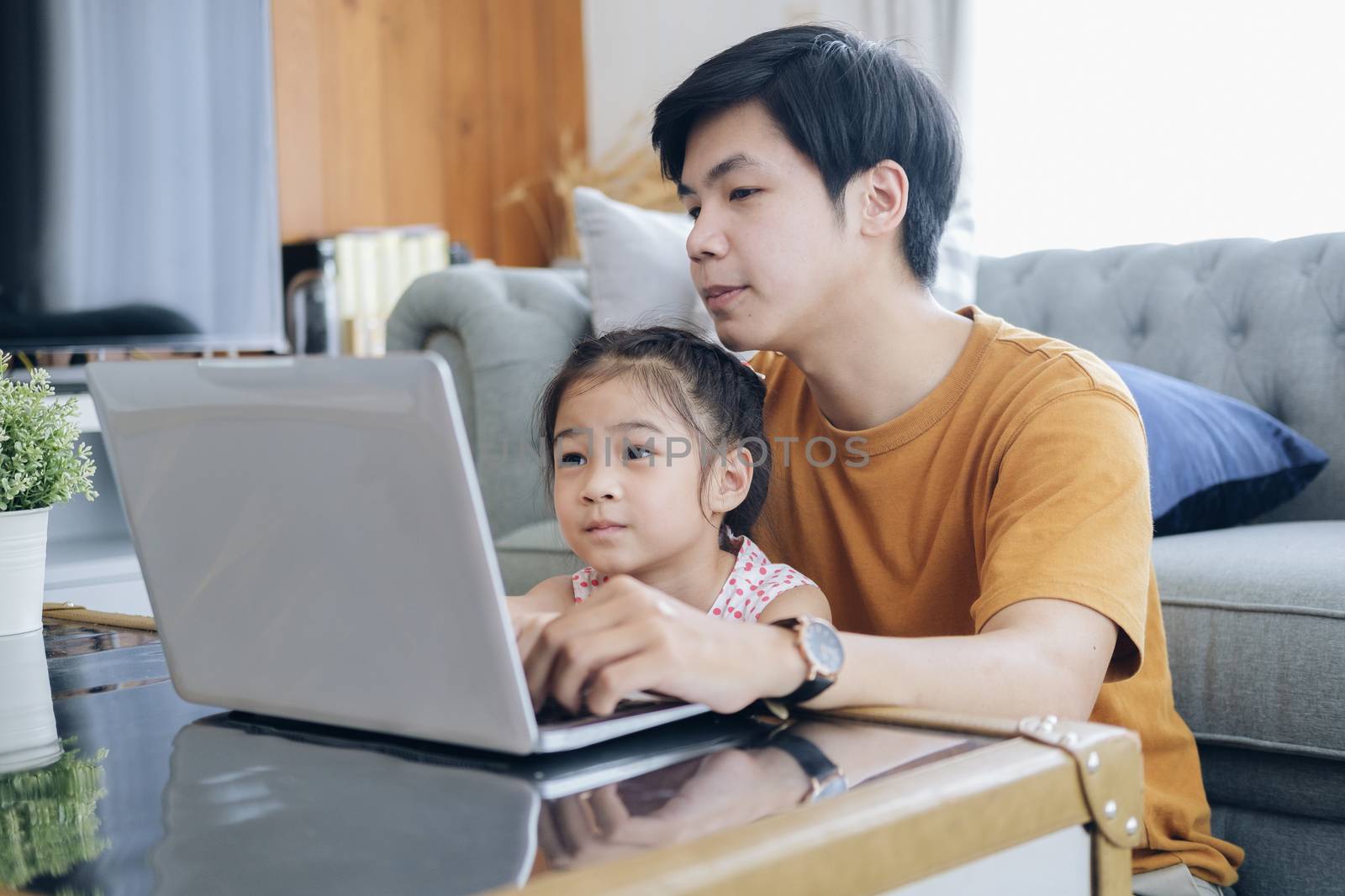 Young man and school-girl working form home, telework and e-learning