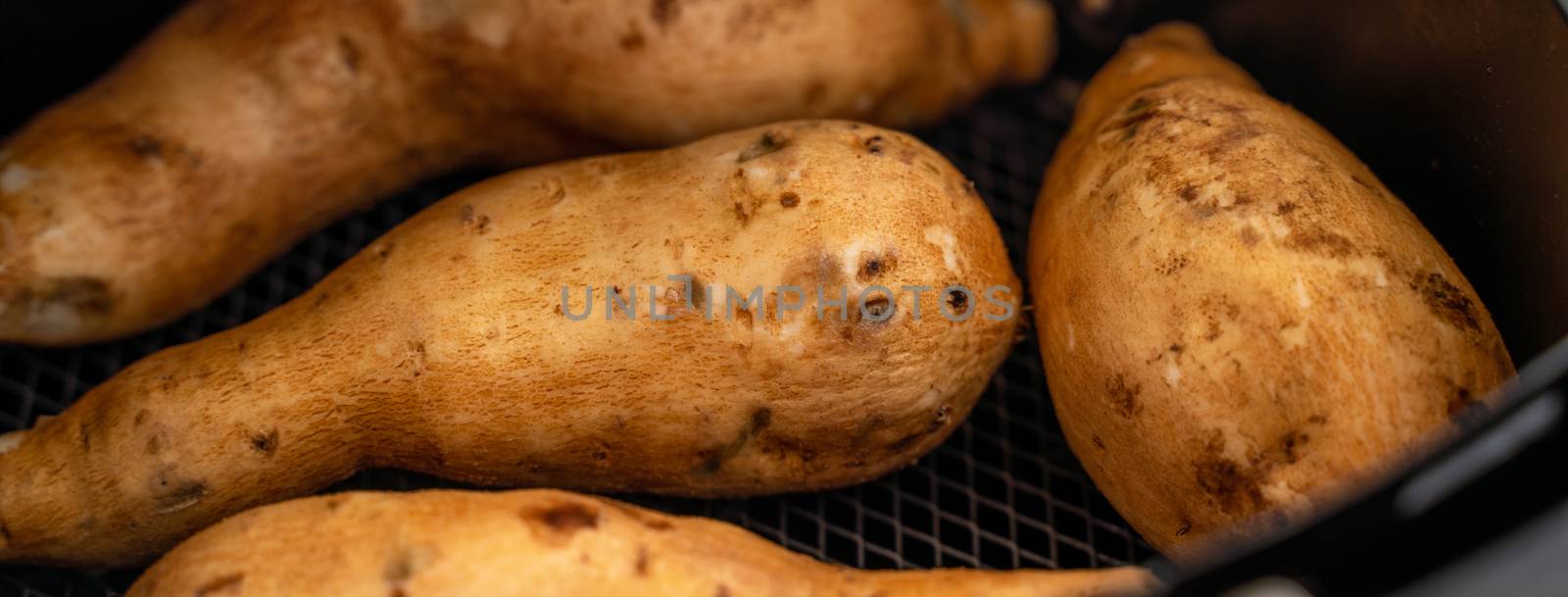 Roasted sweet potato cooked by airfryer at home. Healthy food for diet eating.