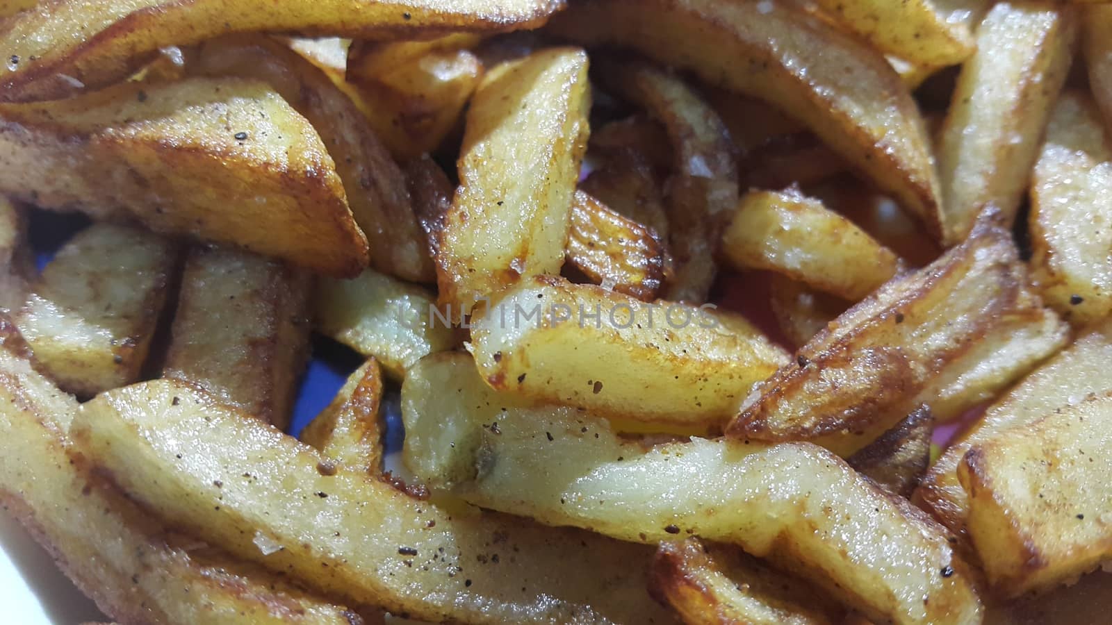 Potato fried or roasted slices on clean background with copy space for text