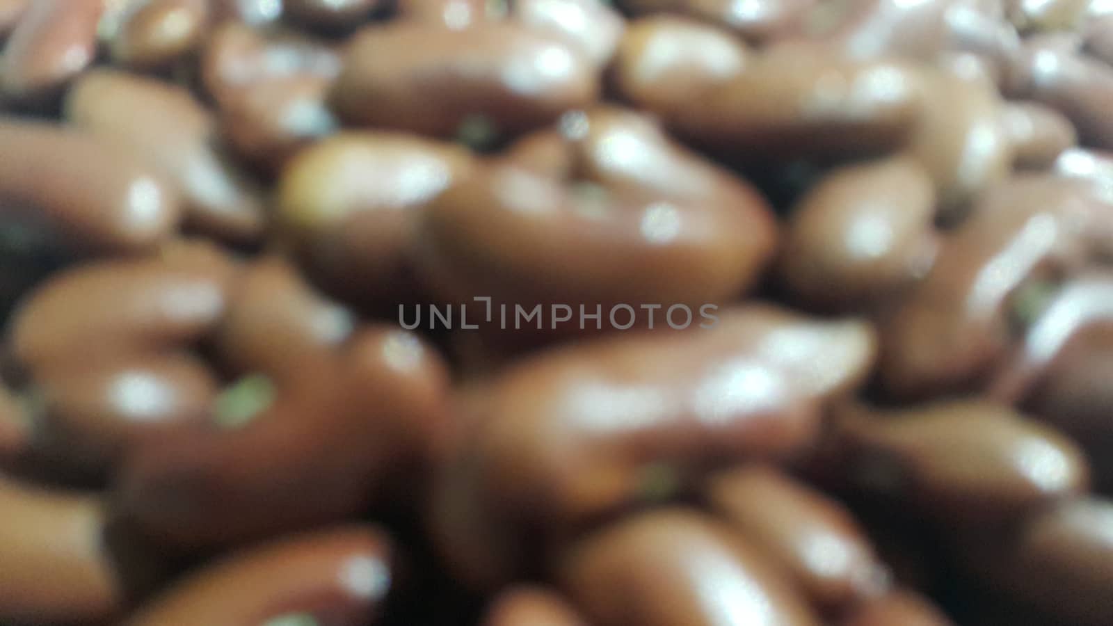Kidenry beans:   Closeup view of uncooked red kidney beans. Dark red useful beans background.