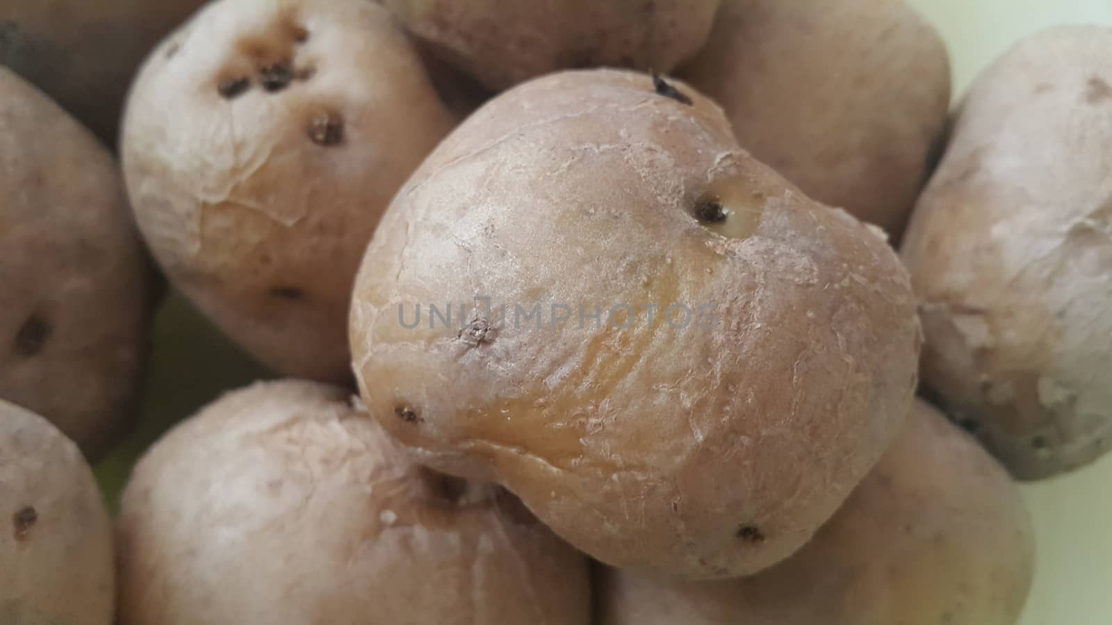  close up view of fresh organic potato in market:  Food background texture of raw potatoes
