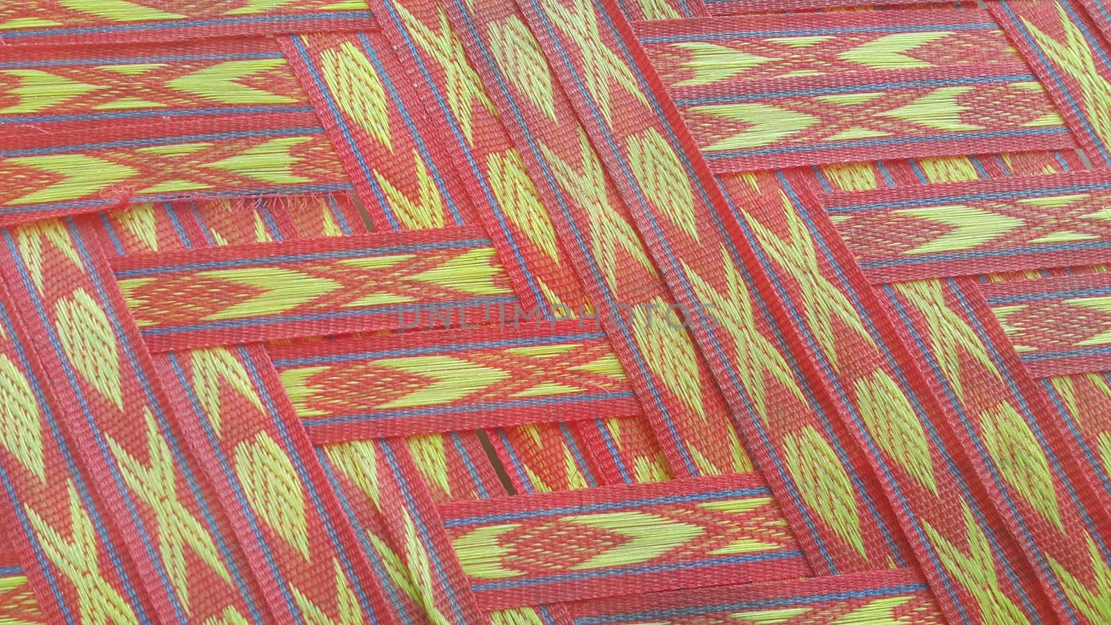 Colorful plastic woven stripes of traditional bed used in rural areas.
